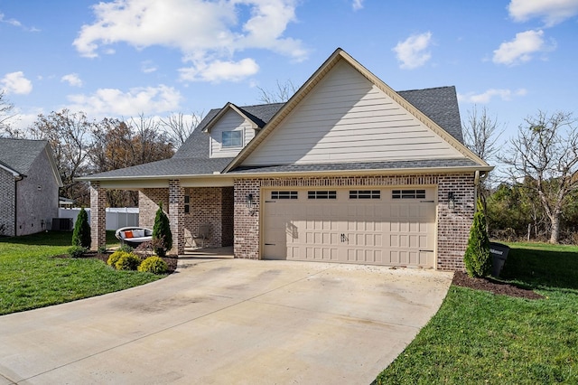 view of front of home featuring brick siding, roof with shingles, a garage, driveway, and a front lawn