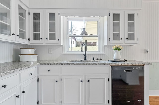 kitchen featuring a sink, glass insert cabinets, dishwasher, and white cabinetry