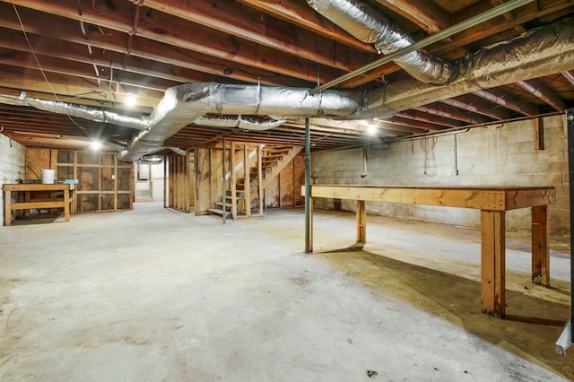 unfinished basement with stairs