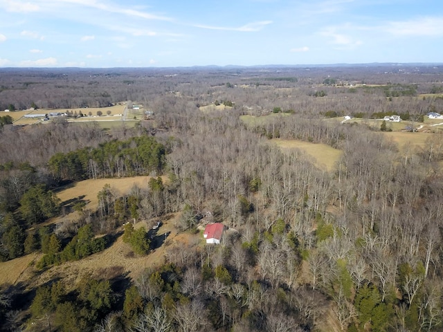 aerial view featuring a wooded view