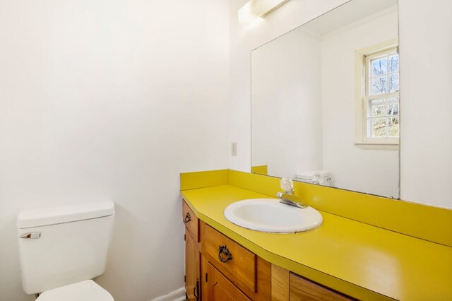 half bath with vanity and toilet