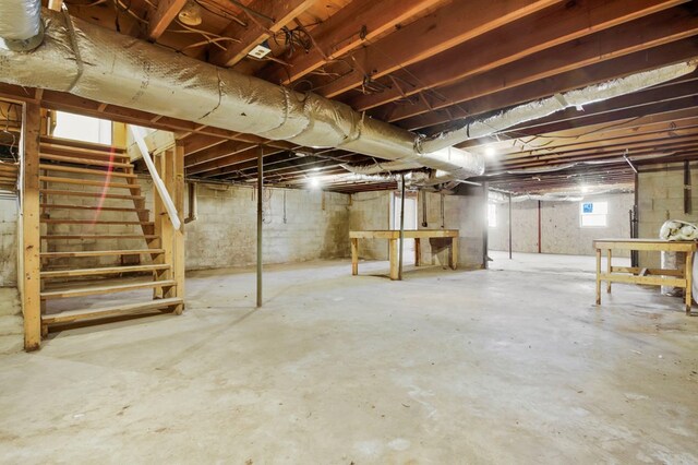 basement featuring stairs