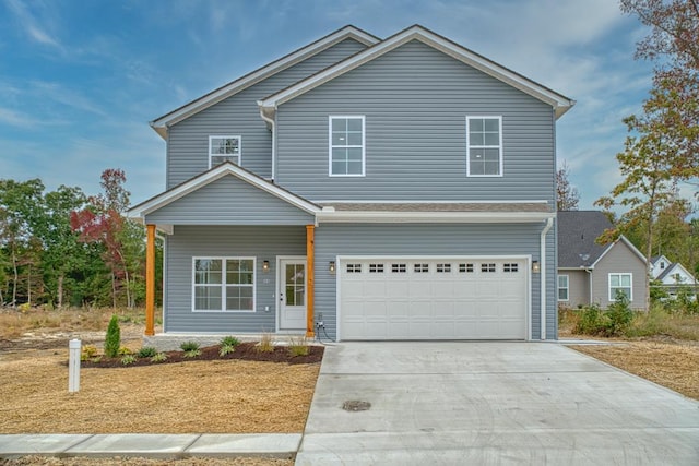 traditional-style house with driveway and an attached garage