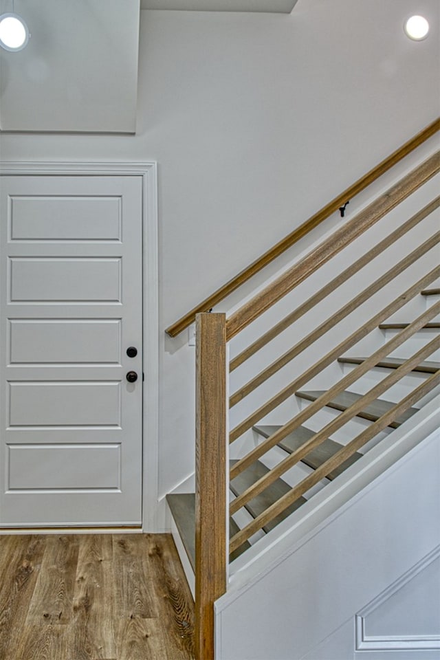 interior space with wood finished floors and recessed lighting