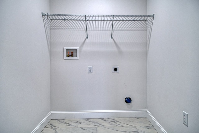 clothes washing area with marble finish floor, hookup for an electric dryer, baseboards, and laundry area