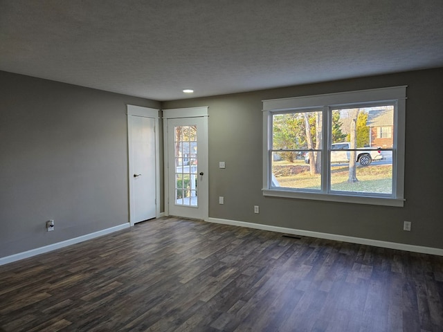 interior space with dark wood finished floors and baseboards