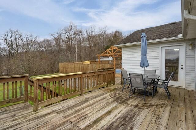 deck with outdoor dining area