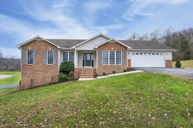 ranch-style house featuring a garage, a front yard, aphalt driveway, and brick siding