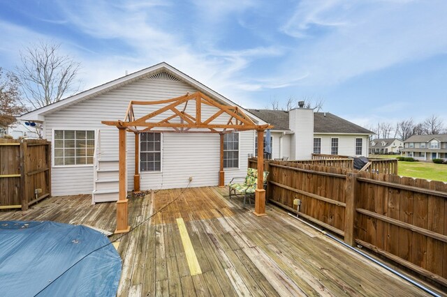 wooden deck with fence and a pergola