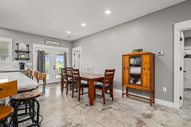 dining room with recessed lighting, baseboards, and french doors