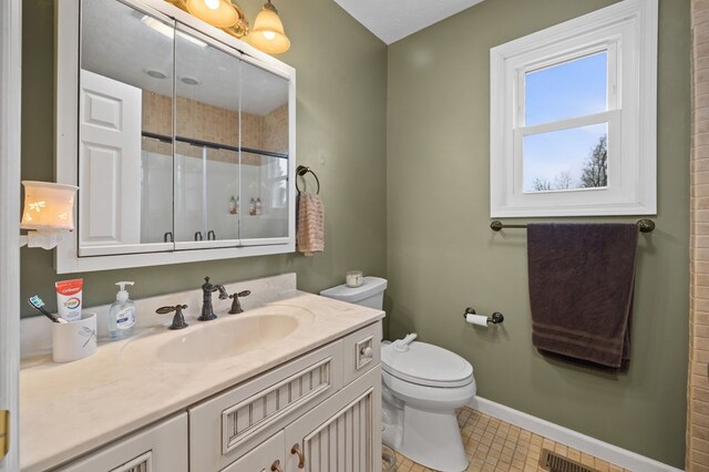 bathroom featuring baseboards, visible vents, toilet, curtained shower, and vanity