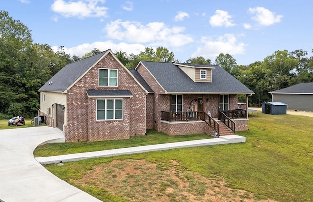 view of front of house with covered porch, a garage, brick siding, concrete driveway, and a front lawn