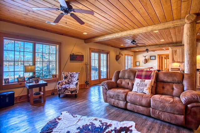 living area featuring baseboards, visible vents, wooden ceiling, wood finished floors, and beamed ceiling