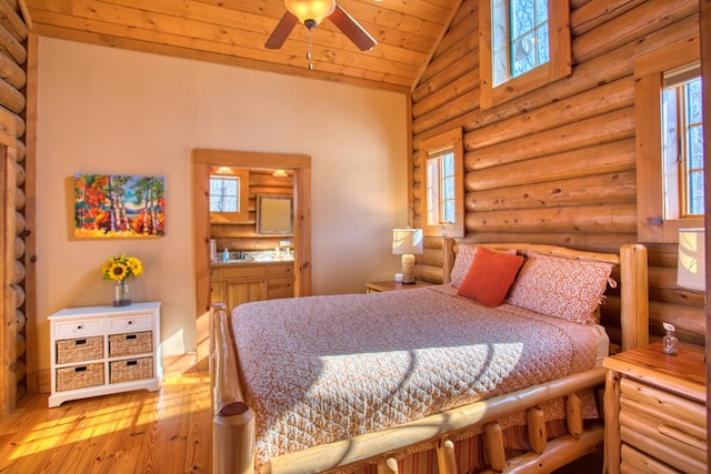 bedroom with high vaulted ceiling, wood ceiling, rustic walls, and wood-type flooring