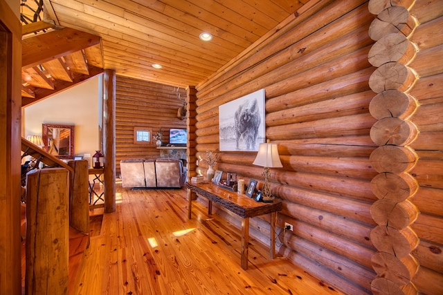 hallway with wooden ceiling, wood-type flooring, rustic walls, and recessed lighting