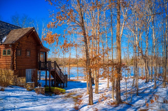 exterior space with log exterior and stairs