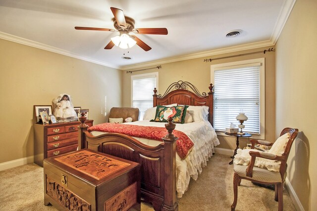 bedroom featuring baseboards, visible vents, a ceiling fan, light colored carpet, and ornamental molding