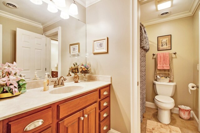 bathroom featuring visible vents, toilet, ornamental molding, vanity, and tile patterned floors