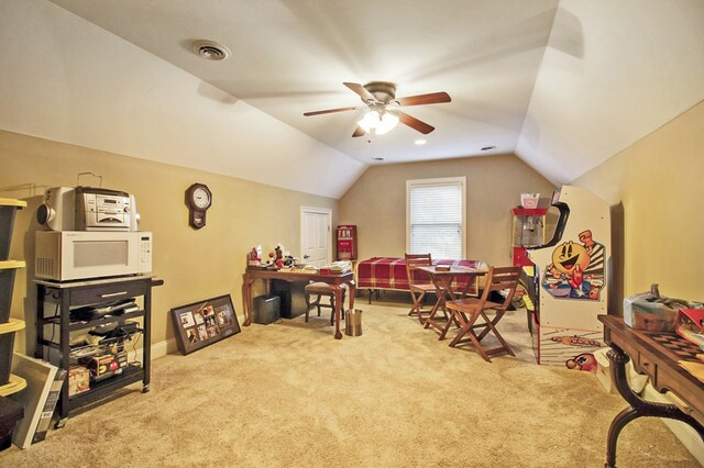 recreation room featuring lofted ceiling, light carpet, ceiling fan, and visible vents