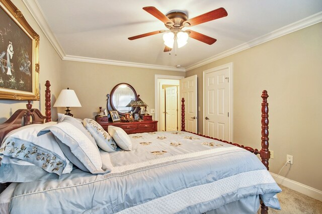 bedroom with ornamental molding, carpet, a ceiling fan, and baseboards