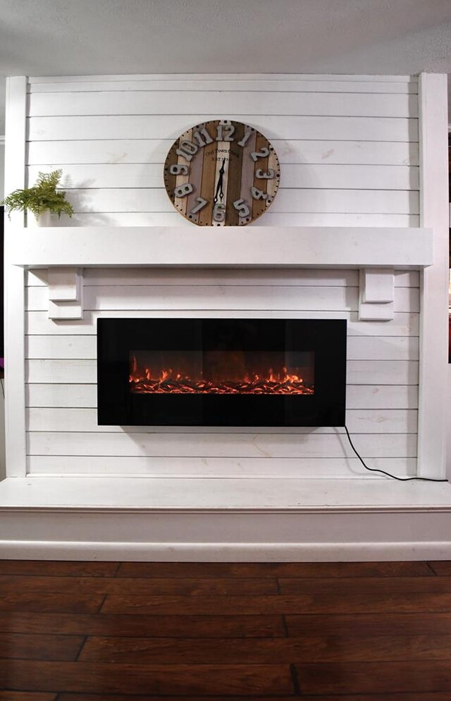 interior details with a lit fireplace