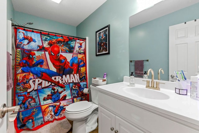 full bath featuring curtained shower, vanity, and toilet