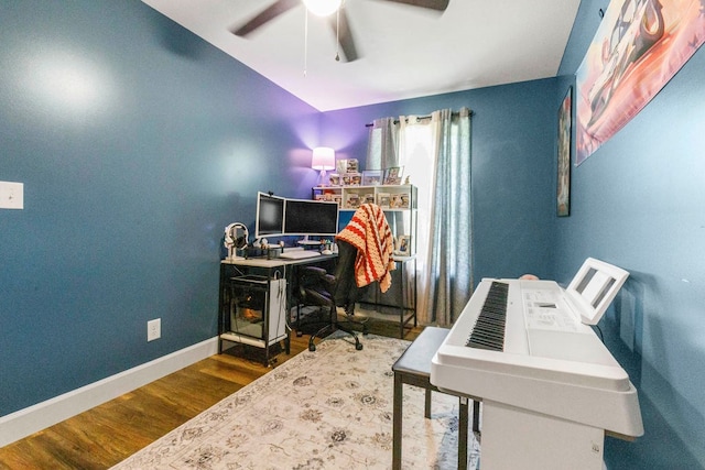 office space featuring ceiling fan, baseboards, and wood finished floors