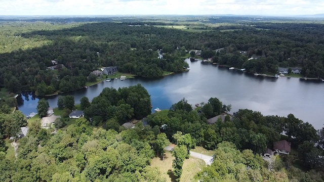 aerial view featuring a water view and a wooded view