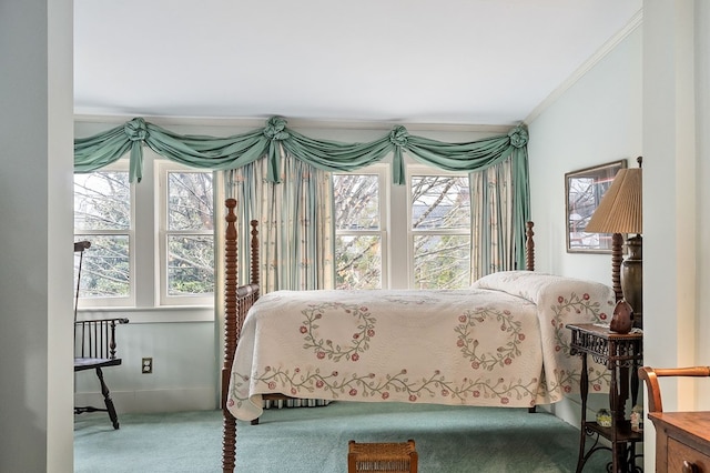 carpeted bedroom with ornamental molding, multiple windows, and baseboards