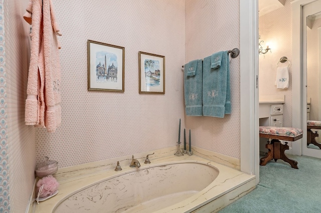 bathroom with a bath and wallpapered walls