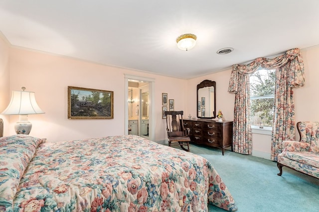 carpeted bedroom with visible vents, connected bathroom, and ornamental molding