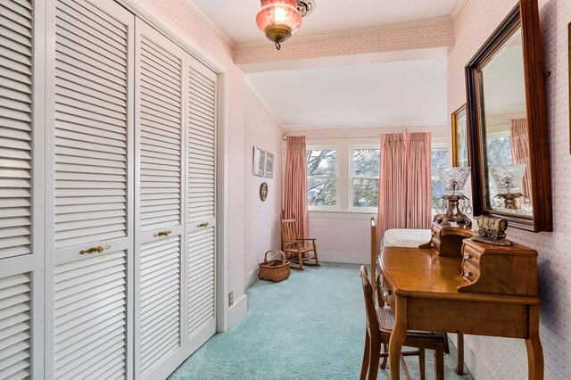 interior space featuring baseboards, ornamental molding, light colored carpet, and wallpapered walls