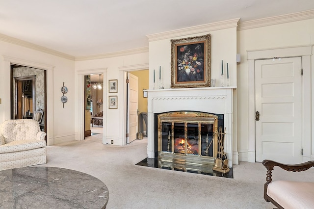 living area featuring a fireplace with flush hearth, light colored carpet, ornamental molding, and baseboards