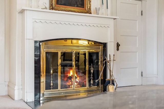 room details with a glass covered fireplace