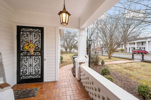 doorway to property with fence