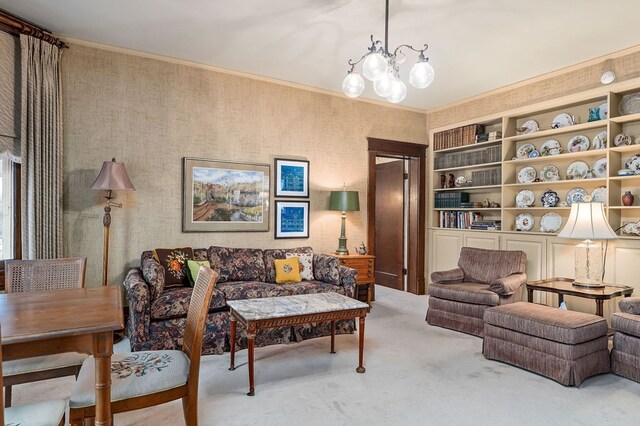 living room with a notable chandelier, crown molding, and carpet flooring