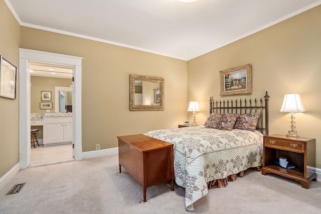 bedroom featuring visible vents, ornamental molding, light carpet, ensuite bath, and baseboards