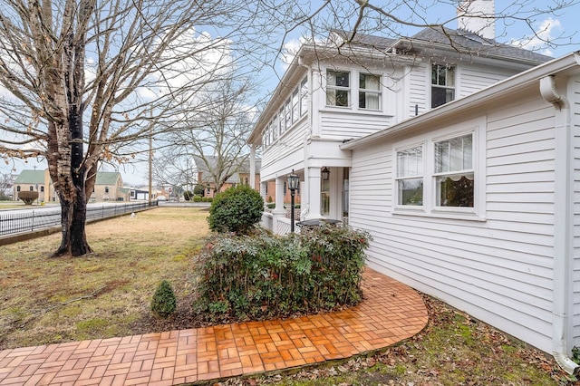 view of home's exterior featuring a yard