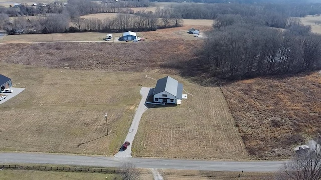 birds eye view of property featuring a rural view