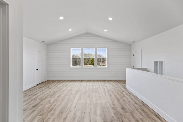 bonus room with light wood-style flooring, recessed lighting, visible vents, baseboards, and vaulted ceiling