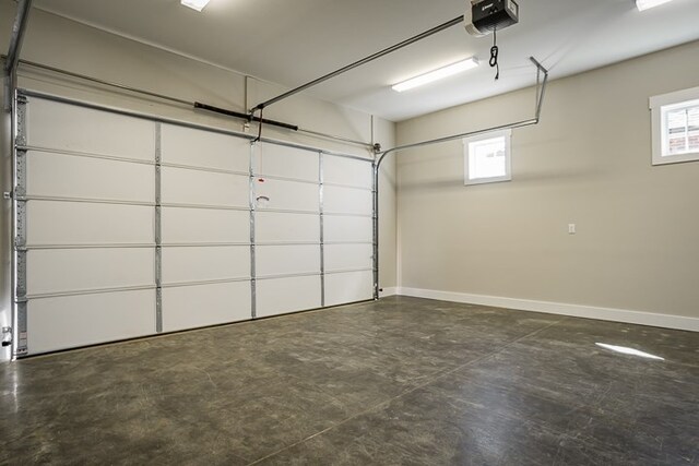 garage featuring baseboards and a garage door opener