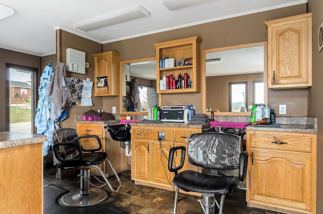 kitchen featuring a toaster and crown molding