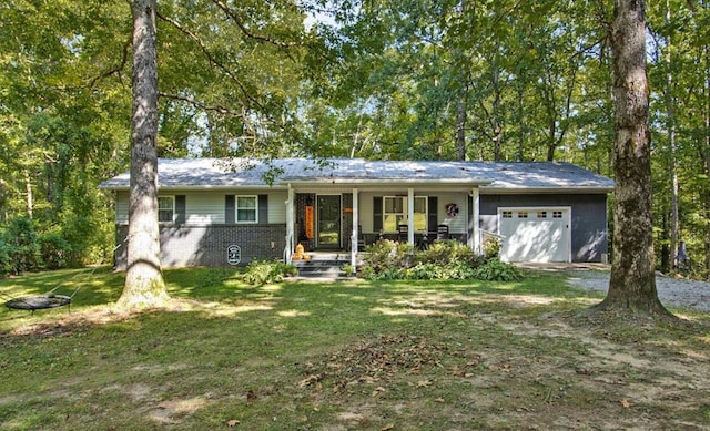 ranch-style house with an attached garage, covered porch, a front yard, and brick siding