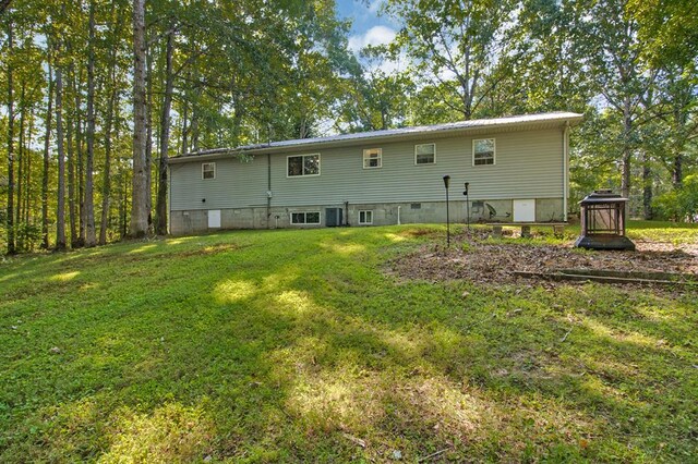 back of house with a yard