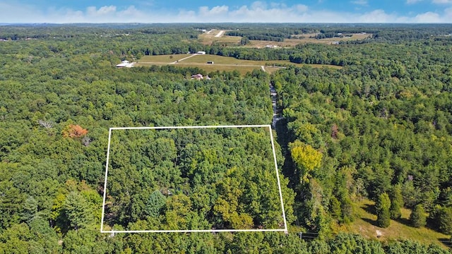 aerial view featuring a forest view