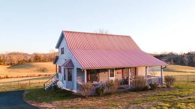 view of front of property with covered porch and metal roof