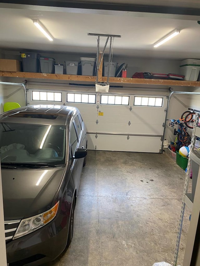 garage featuring a garage door opener