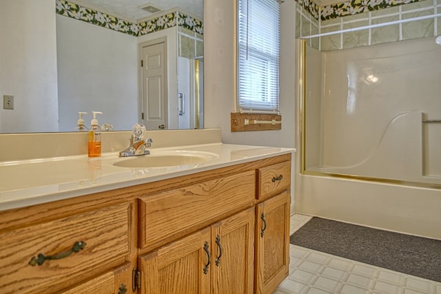 full bath with vanity, visible vents, tub / shower combination, and tile patterned floors