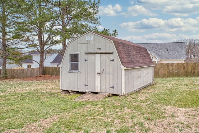 view of shed with a fenced backyard