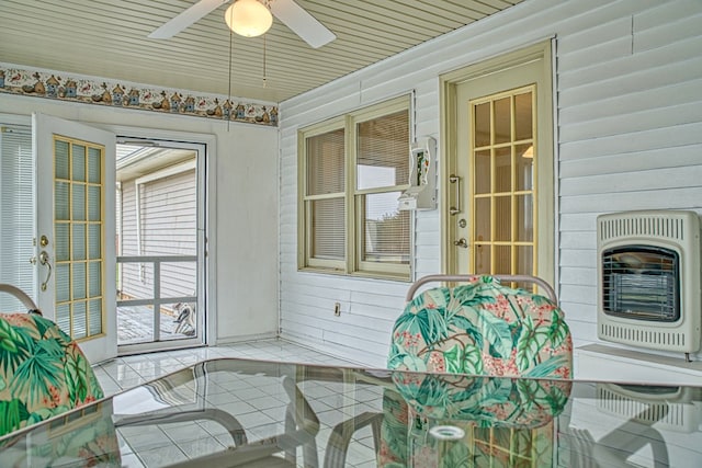 sunroom / solarium with ceiling fan and heating unit